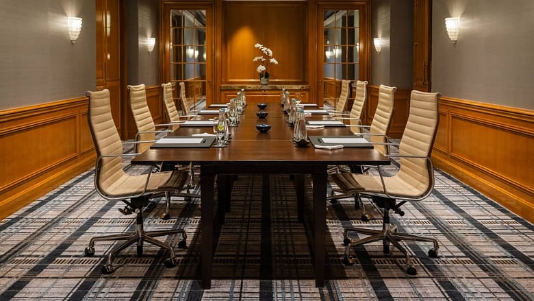 Empty luxury hotel boardroom with no attendees — the intervention nobody showed up to
