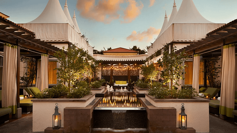 Luxury oceanfront resort pool at Eau Palm Beach Resort and Spa, illustrating the hotel marketing funnel from first awareness to booking