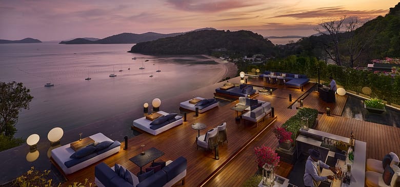 Aerial view of a luxury independent resort terrace at sunset, overlooking a calm ocean bay — illustrating the market opportunity and structural challenges facing independent luxury hotels over the next five years.