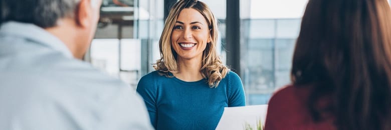 Luxury travel advisor consulting with a couple while planning a cruise vacation