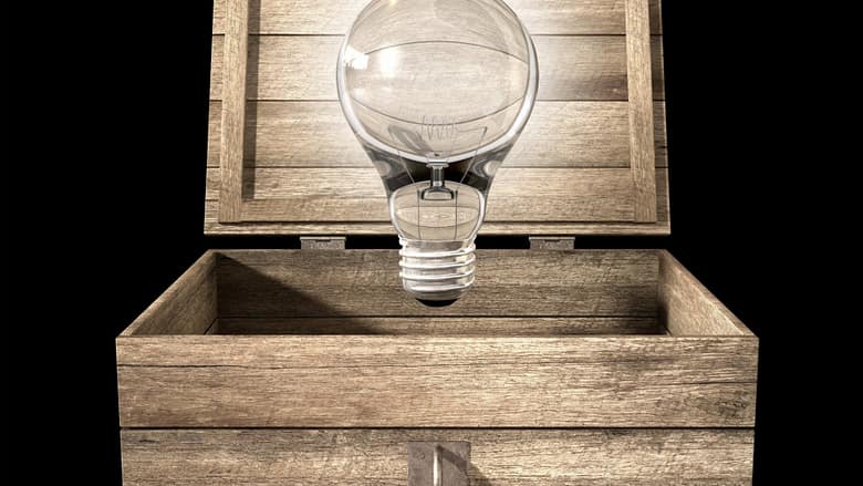 Light bulb emerging from an open wooden box representing AI booking agents reshaping decision-making and demand selection in luxury hospitality
