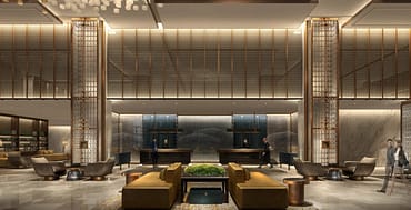 Grand luxury hotel lobby interior with double-height ceilings, marble walls, and reception desk, illustrating the high-stakes economics of rate parity and direct booking strategy in independent luxury hospitality.