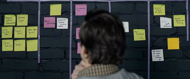 Executive reviewing strategic planning notes illustrating analysis of luxury hotel growth and underlying demand systems