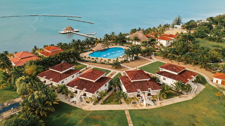 Aerial view of a luxury beachfront resort destination where travelers discover hotels during trip planning