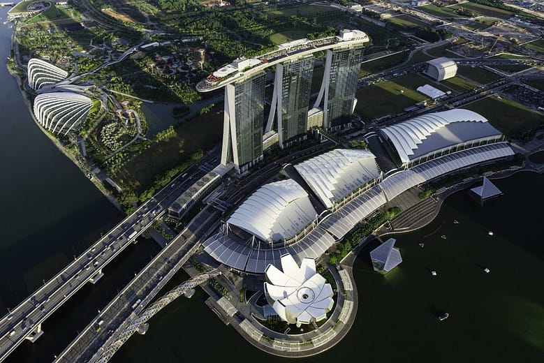 Aerial view of Marina Bay Sands in Singapore showing the three towers and SkyPark from above