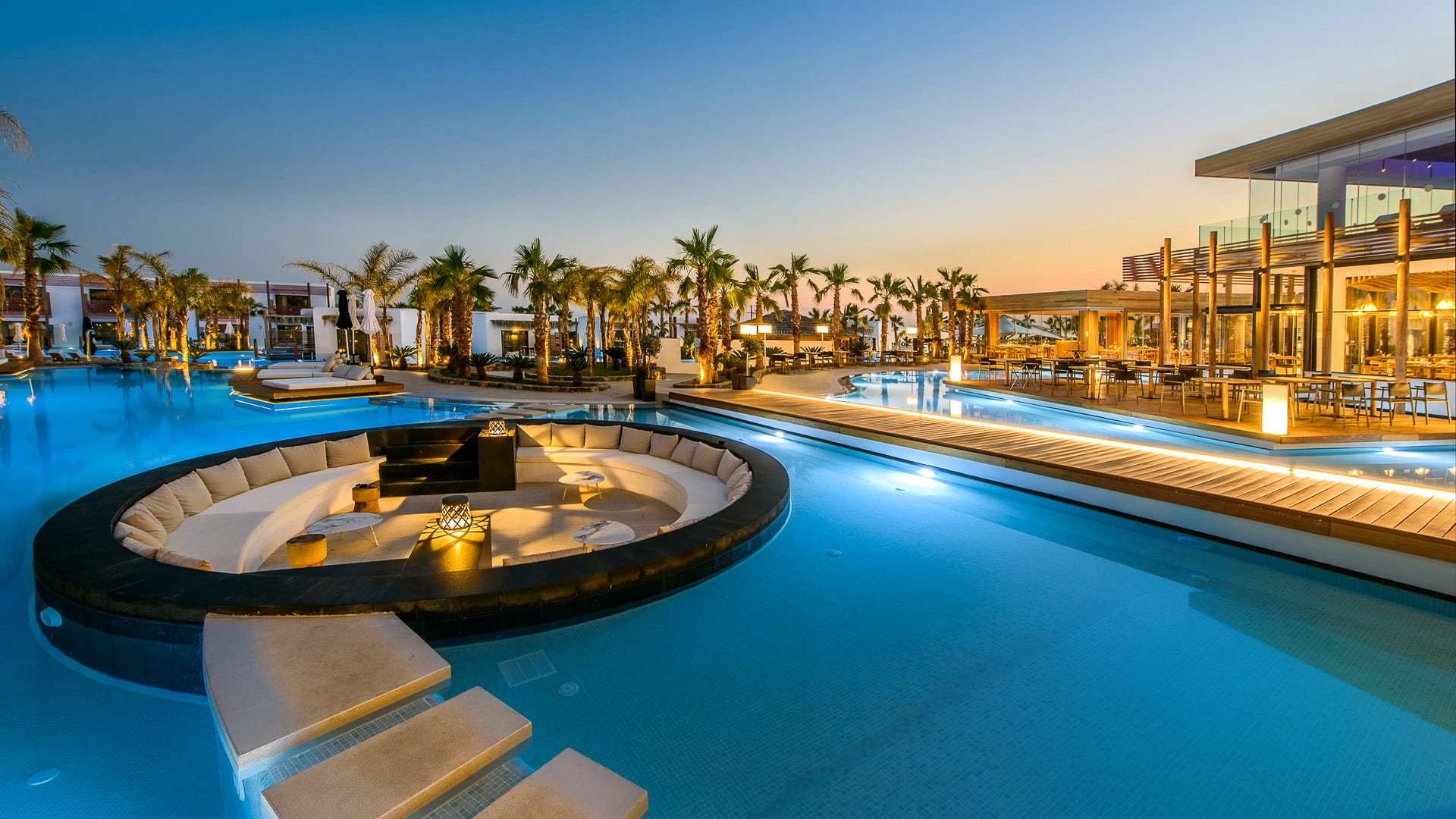 Luxury resort pool at sunset illustrating luxury hotel demand ownership and audience ownership
