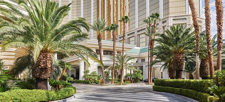 Four Seasons Hotel Las Vegas entrance and porte cochere framed by palm trees, the best hotel in Las Vegas