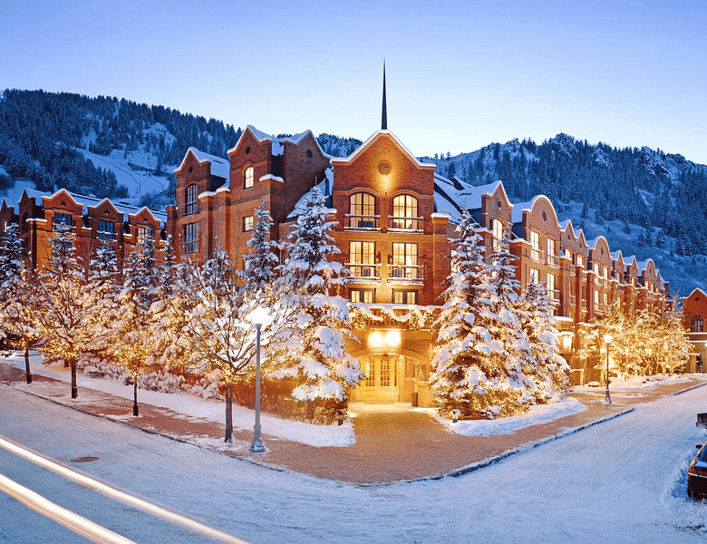 Luxury mountain resort in winter at dusk, representing the future of luxury hospitality marketing in 2026 through AI-driven personalization, automation, and elevated guest experiences.